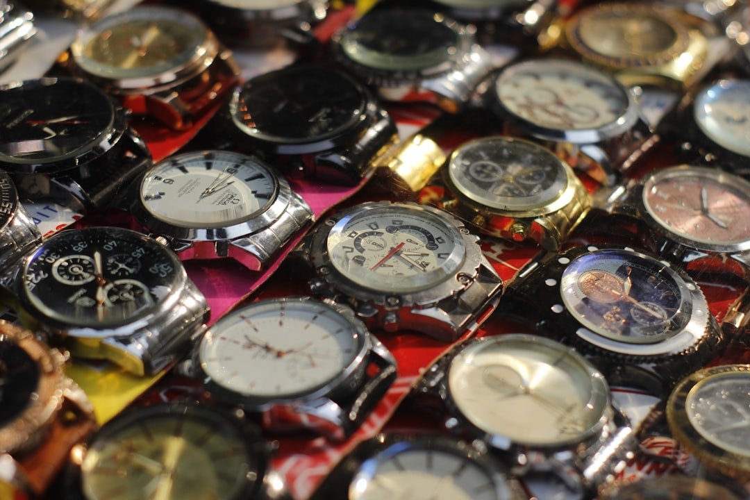 Comparison of different watch case materials including steel, gold, and titanium