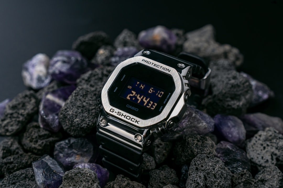 Woman wearing elegant rose gold watch with mother of pearl dial